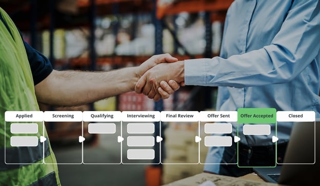 Manufacturing manager shakes hands with new emloyee