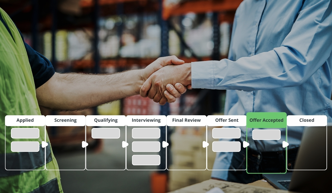Manufacturing manager shakes hands with new emloyee